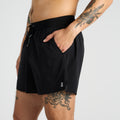 Thumbnail of Side view of the Vento™ 5" Men's Training Short, featuring a reflective logo, custom waistband, and branded drawsting with a hand shown in one of the front slash pockets.